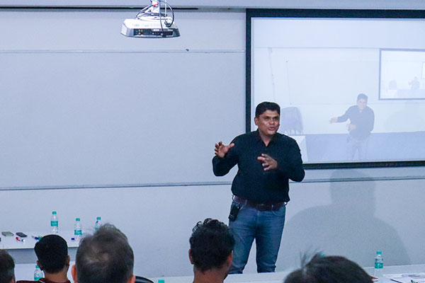 People engaged in a classroom setting, with sessions on career path planning, unlimited 1:1 career coaching