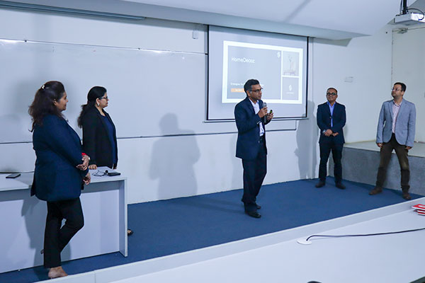 People engaged in a classroom setting with comprehensive frameworks and skill-hackathons in progress