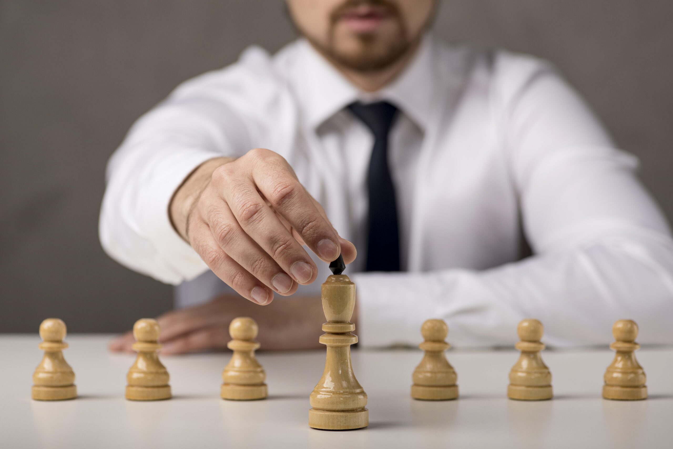 Businessman holding Chess board king