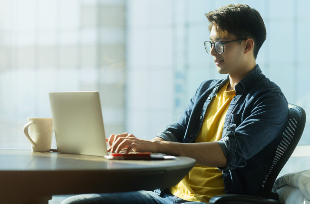 Tech Employee with a laptop on the Table